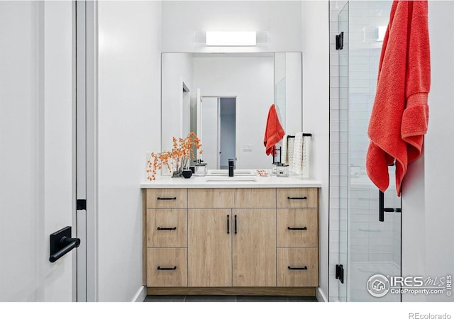 2125 Vine Ave, Boulder, CO 80304 - bathroom with a shower stall, vanity, and baseboards