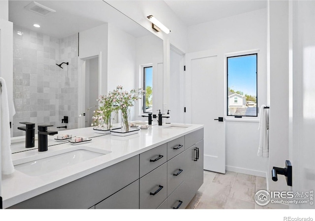 2125 Vine Ave, Boulder, CO 80304 - full bath with tiled shower, double vanity, recessed lighting, and baseboards
