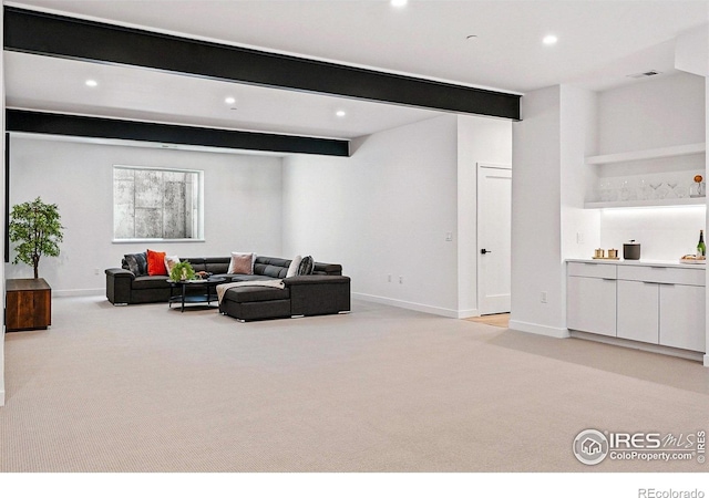 2125 Vine Ave, Boulder, CO 80304 - living room with light colored carpet, beam ceiling, recessed lighting, and baseboards