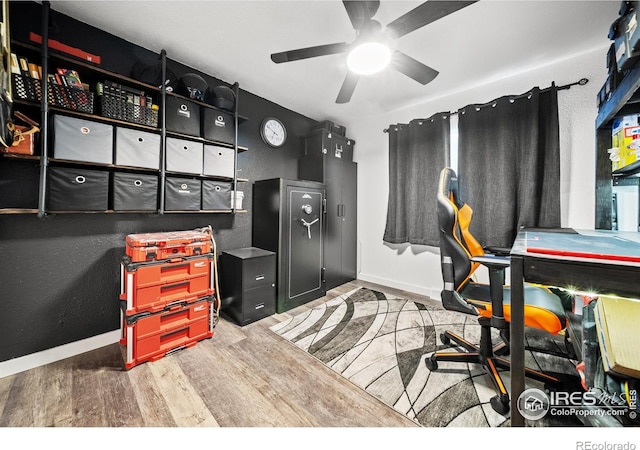 office space with hardwood / wood-style floors and ceiling fan