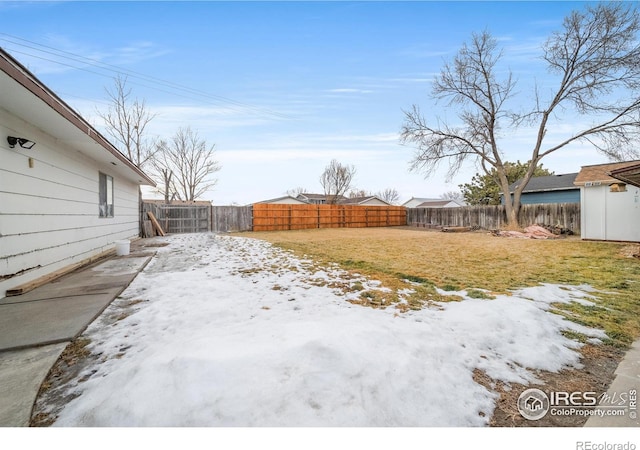 view of yard layered in snow