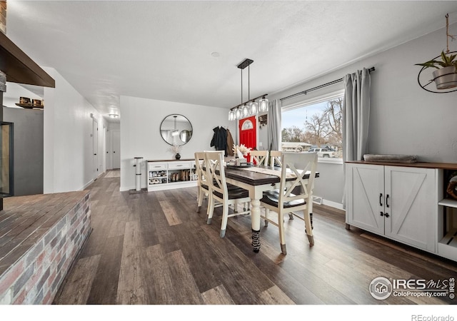 dining space with dark hardwood / wood-style floors