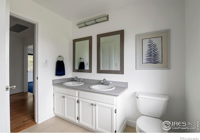 bathroom with vanity, tile patterned floors, and toilet