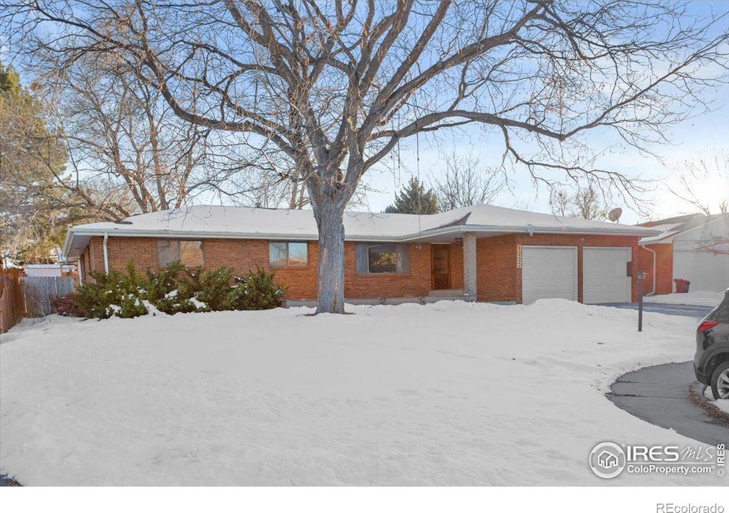 single story home featuring a garage