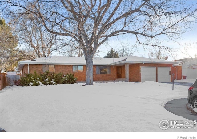 single story home featuring a garage