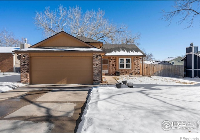 single story home with a garage