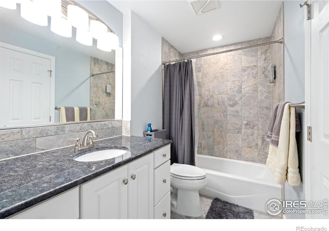 full bathroom with vanity, shower / bathtub combination with curtain, and toilet