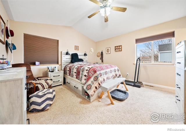 carpeted bedroom featuring lofted ceiling and ceiling fan