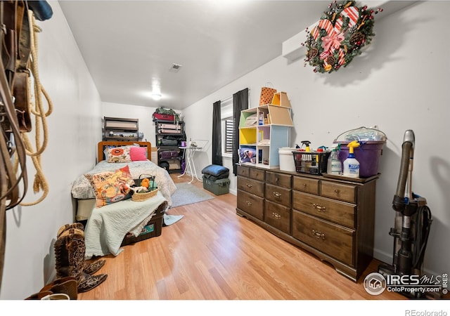 bedroom with light hardwood / wood-style floors