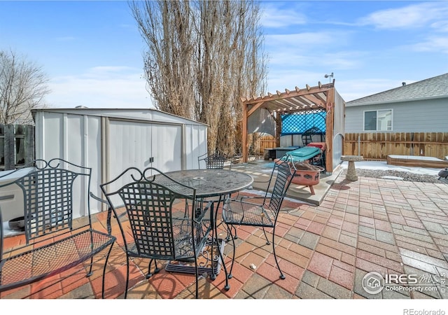 view of patio with a shed and a pergola