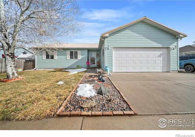 ranch-style home featuring a garage and a front lawn