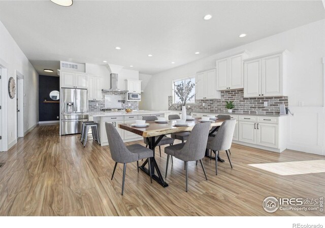 dining space featuring light hardwood / wood-style flooring