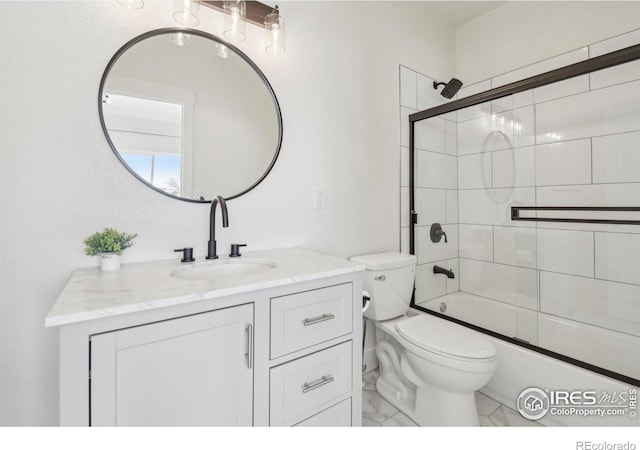 full bathroom with vanity, shower / bath combination with glass door, and toilet