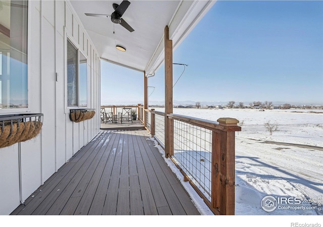 snow covered deck with ceiling fan