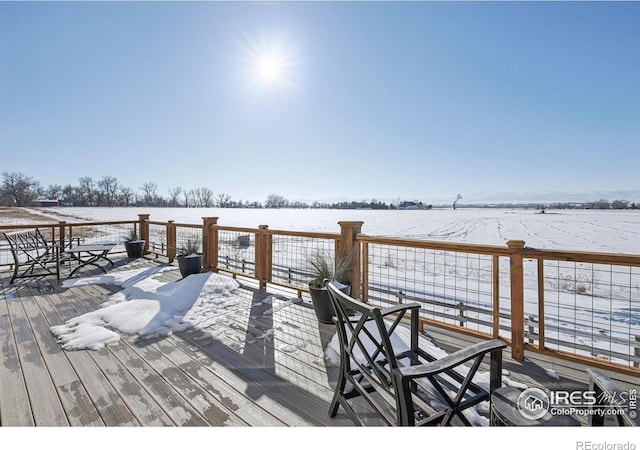 view of dock with a deck and a rural view