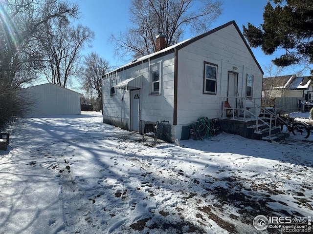 view of snow covered house