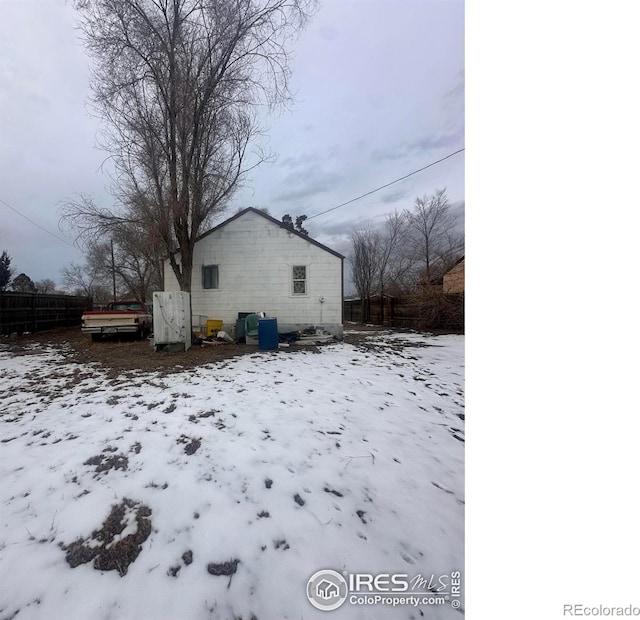 view of snow covered property