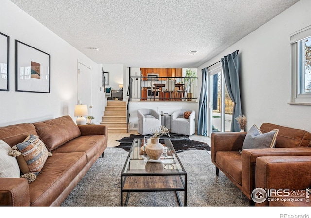 living room featuring a textured ceiling