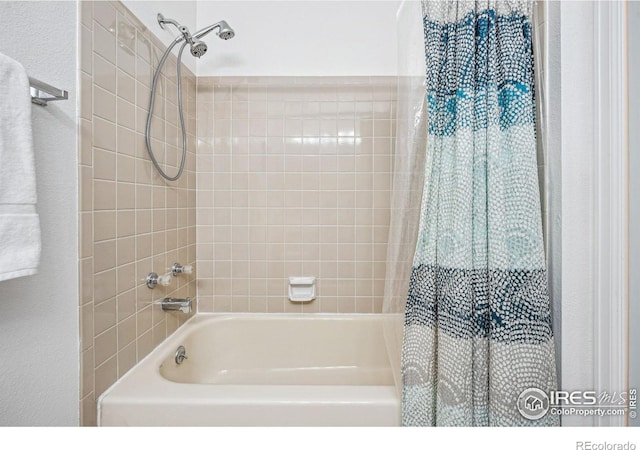 bathroom featuring shower / bathtub combination with curtain