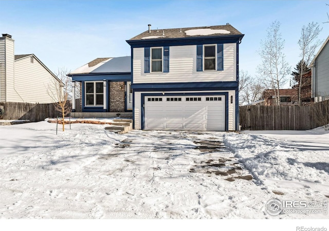 front of property with a garage