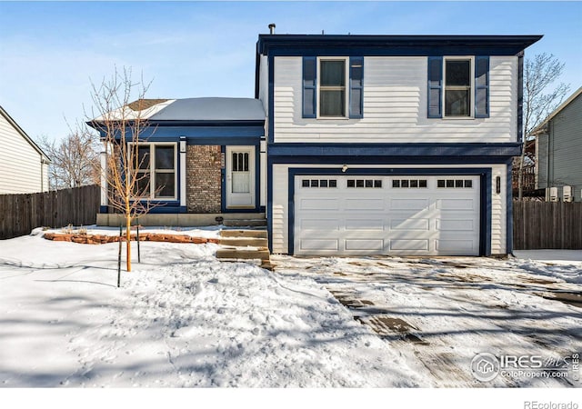 view of front of home with a garage