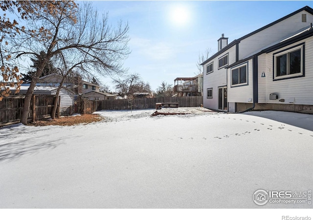 view of yard layered in snow