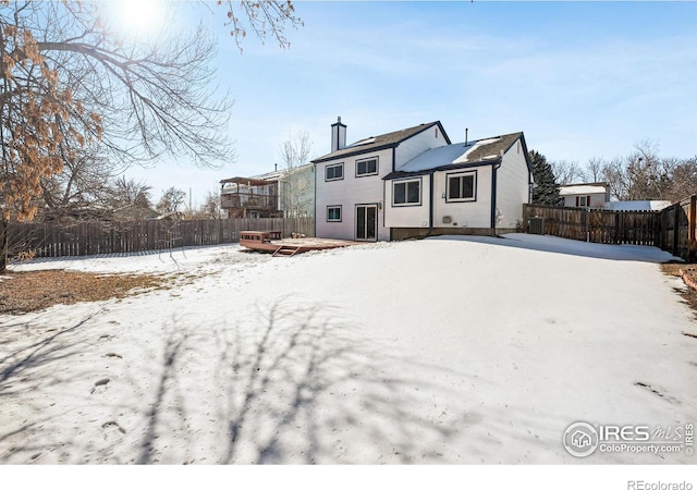 view of snow covered house