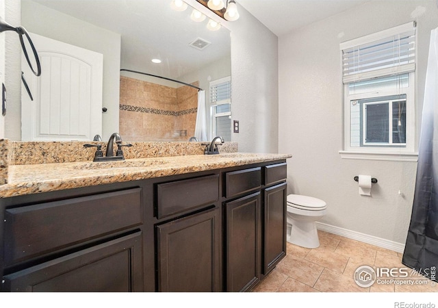 bathroom featuring vanity, a shower with curtain, tile patterned floors, and toilet