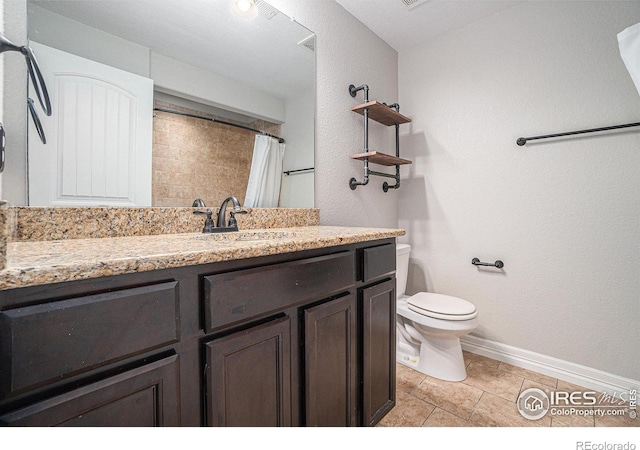 bathroom with vanity, toilet, and a shower with shower curtain