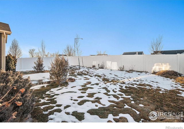 view of yard covered in snow