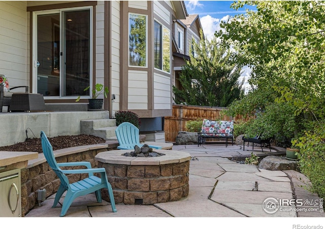 view of patio / terrace featuring a fire pit