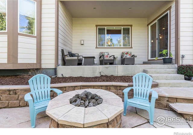 view of patio with a fire pit