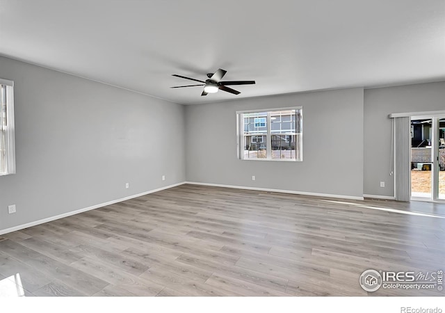 unfurnished room featuring ceiling fan and light wood-type flooring