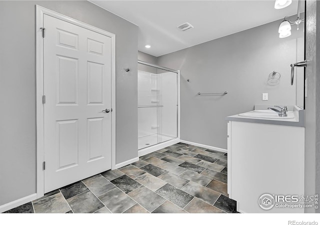 bathroom with vanity and an enclosed shower