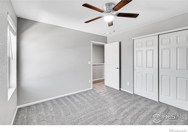 unfurnished bedroom featuring carpet floors, ceiling fan, and a closet