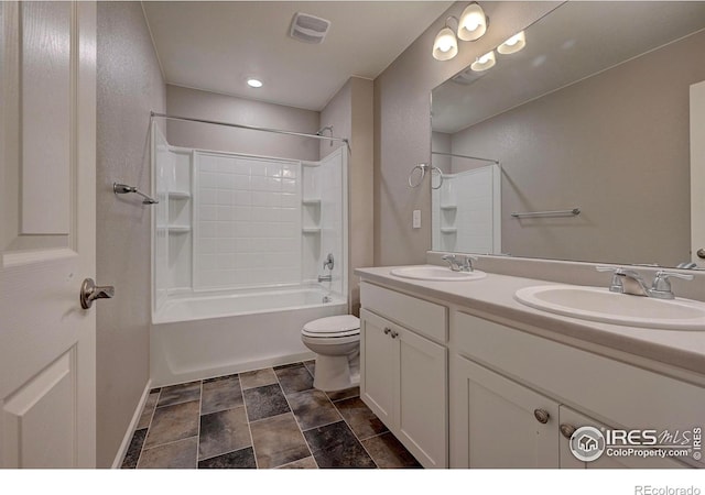 full bathroom with shower / tub combination, vanity, and toilet