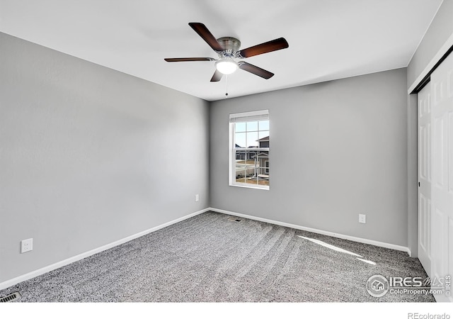 unfurnished bedroom with carpet, ceiling fan, and a closet