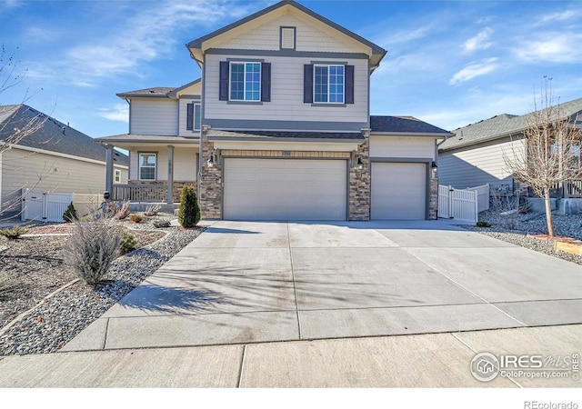 view of front property with a garage and covered porch