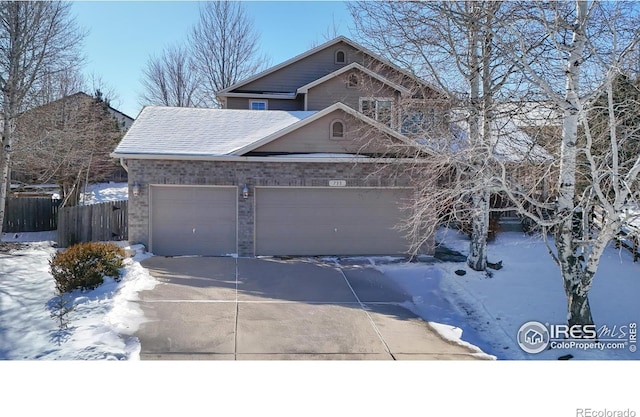 view of front of property featuring a garage