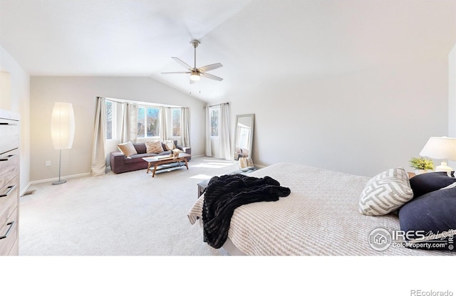 carpeted bedroom with vaulted ceiling and ceiling fan