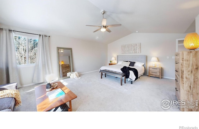 bedroom featuring light carpet, vaulted ceiling, and ceiling fan