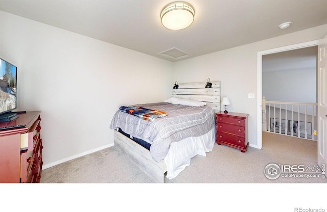 bedroom featuring light carpet