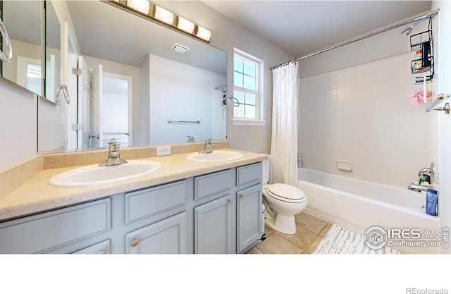 full bathroom with vanity, shower / tub combo with curtain, tile patterned floors, and toilet