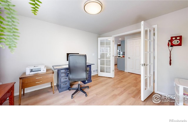 office area featuring french doors and light hardwood / wood-style flooring