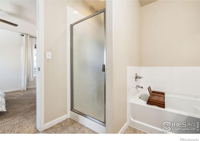 bathroom with tile patterned flooring and independent shower and bath