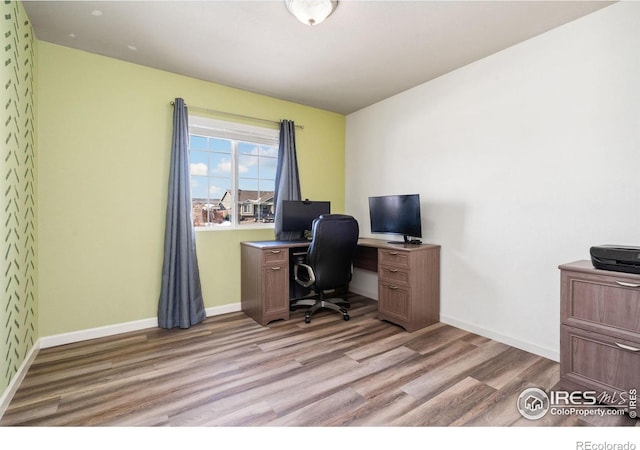 office space with light hardwood / wood-style flooring