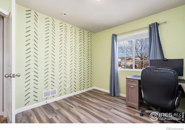 office area with light hardwood / wood-style flooring