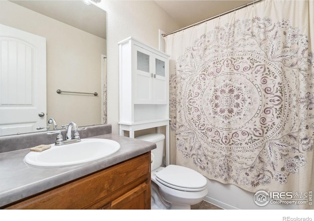 full bathroom featuring vanity, toilet, and shower / bath combo with shower curtain