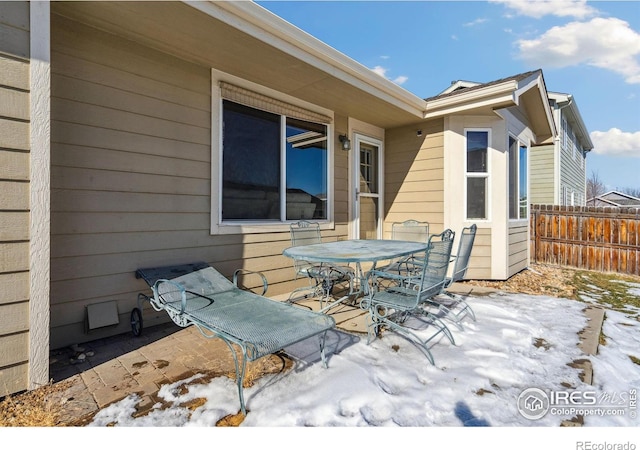 view of snow covered patio