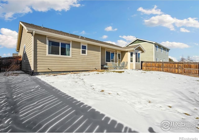 view of snow covered house